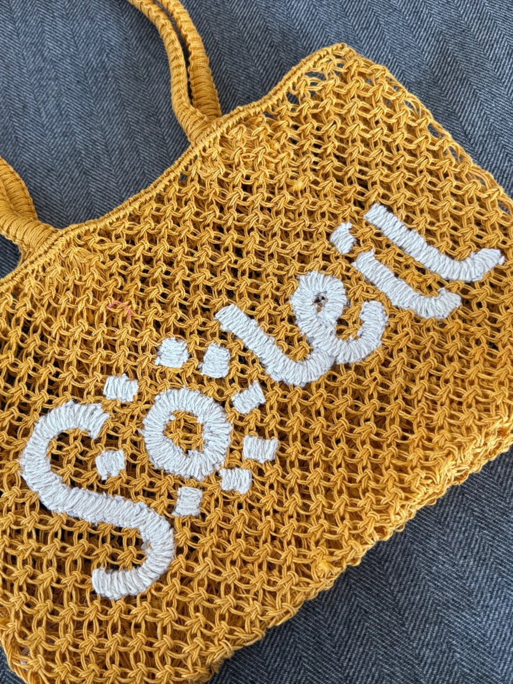 NWOT, RAFFIA WOVEN TOTE WITH DARLING “SOLEIL”